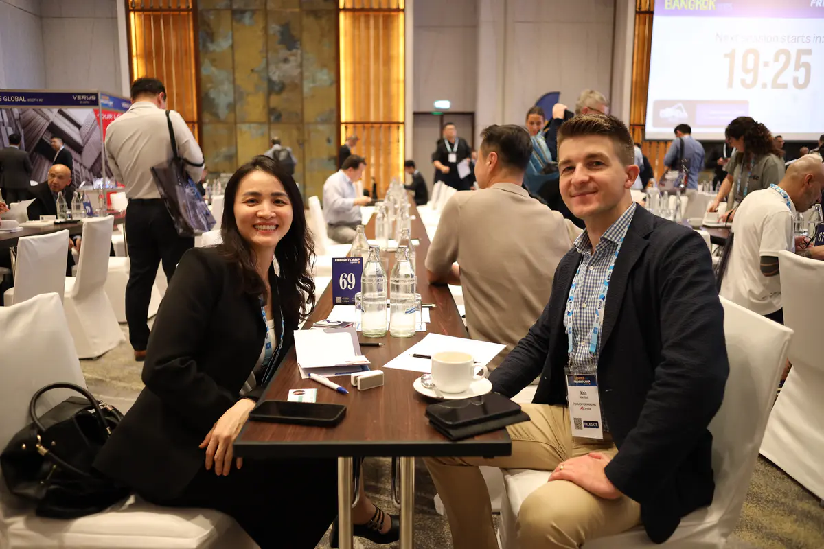 Two delegates seated for a scheduled meeting at Freightcamp Bangkok 2025